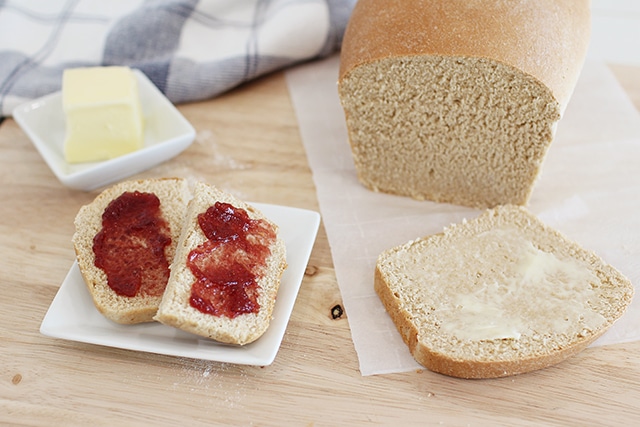 White whole wheat bread with butter and jam