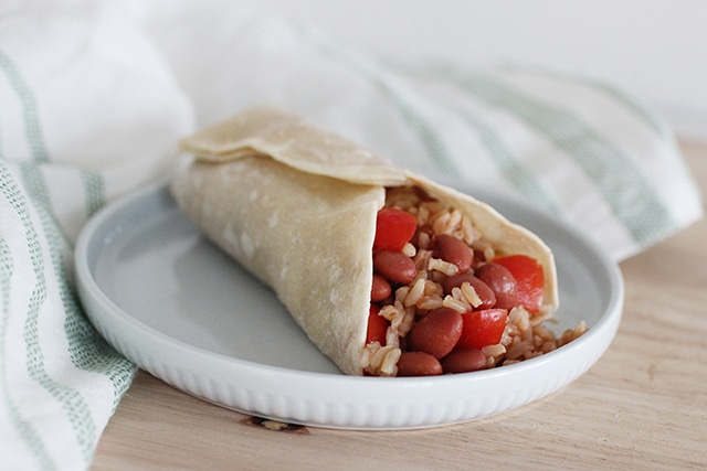 red beans and rice and tomatoes in a wrap