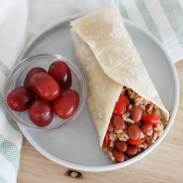 red beans and rice healthy wrap with side of grapes