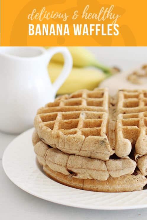 Fluffy banana nut waffles with white pitcher in the background