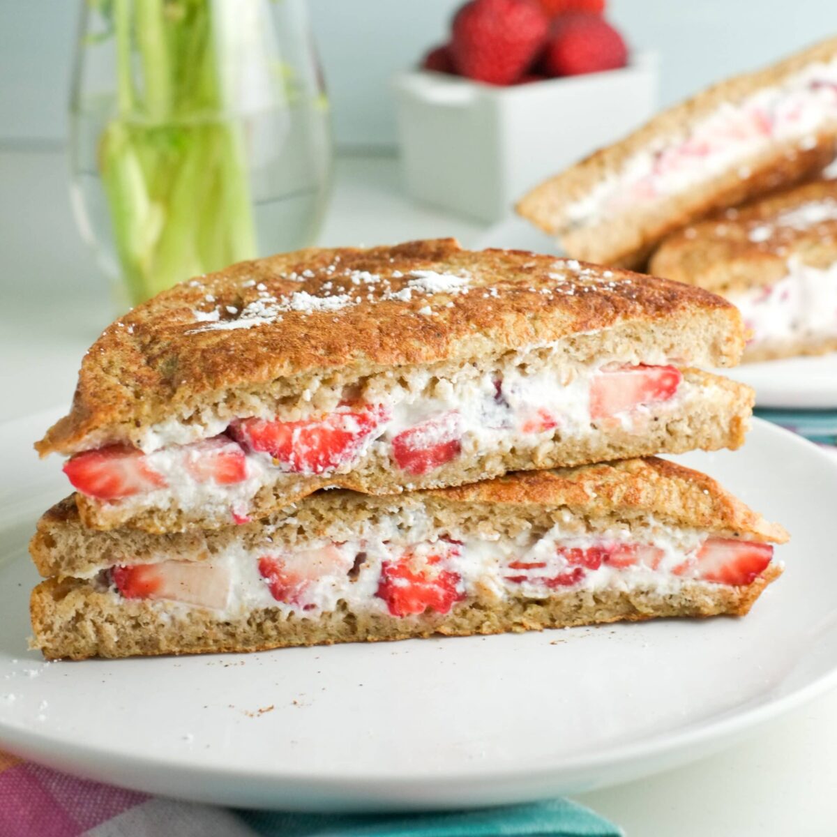 berry stuffed french toast on a white serving plate