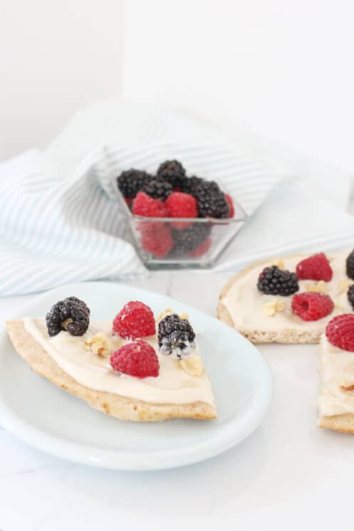 Breakfast pizza slices with berries