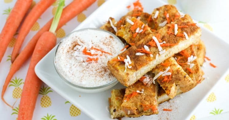 French toast cut into sticks with a bowl of yogurt and carrots in the background