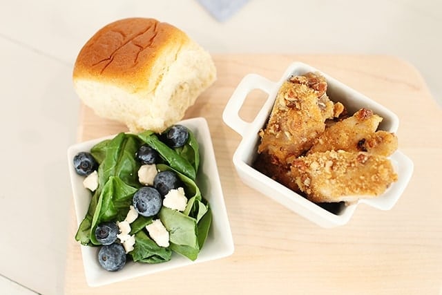 salad with blueberries chicken and a roll