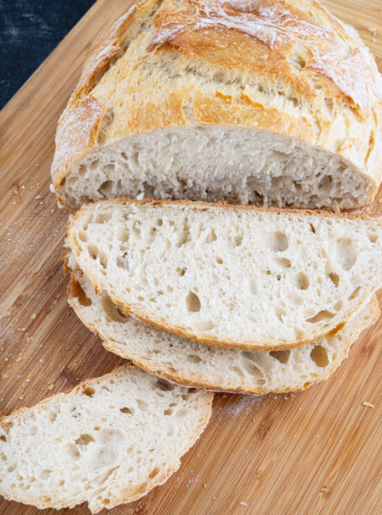 Easy Artisan Bread on a cutting board, just being sliced