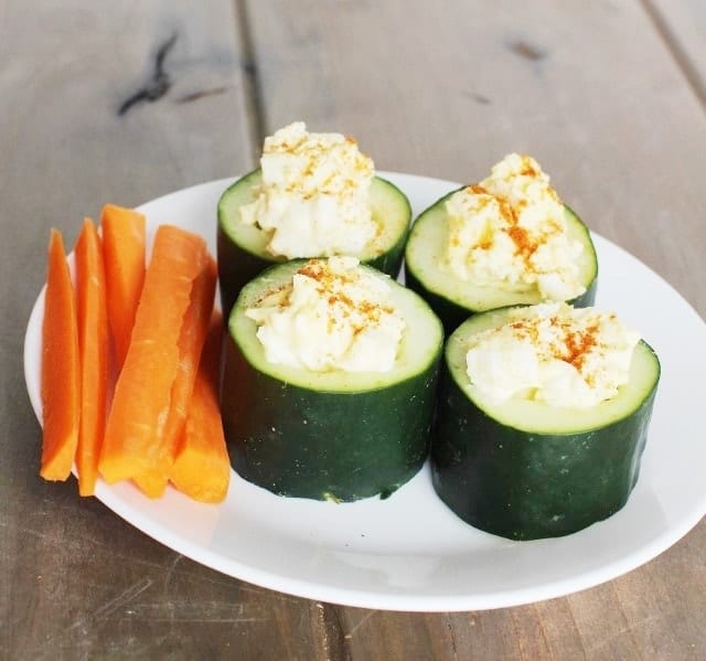 Loaded Cucumber Cups filled with egg salad. Side of carrot sticks.