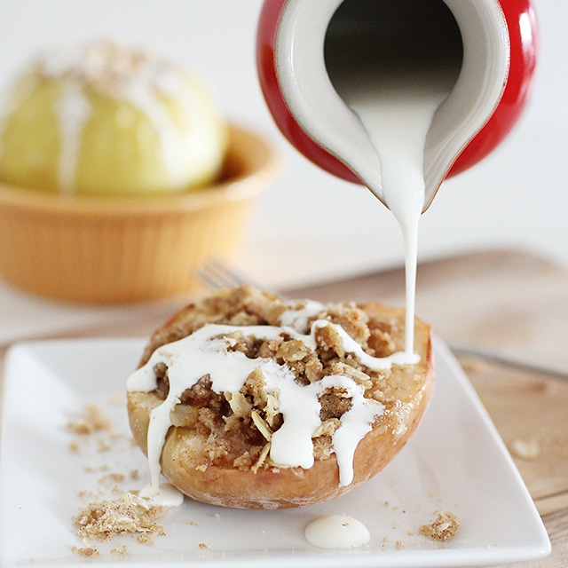 Warm baked apples are easy for little ones to chew and stuffed with an irresistible streusel topping made from whole grain oats, brown sugar, and spices. pouring cream over a baked apple