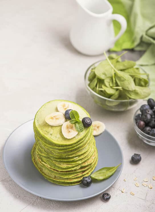 Green pancakes with spinach, healthy breakfast or snack, vegetarian food