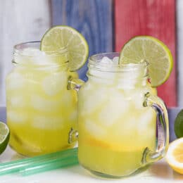 All natural moisturizing drinks in a glass with lime wedges