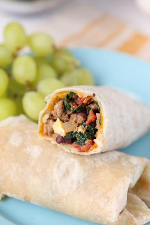 Protein Packed Breakfast Burritos for kids! with grapes in the background