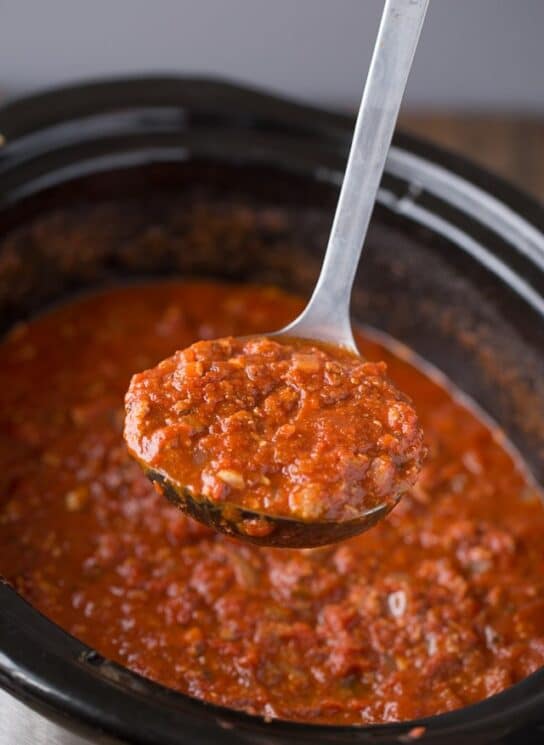 Slow Cooker Turkey Bolognese Recipe the whole family will love! sauce being scooped