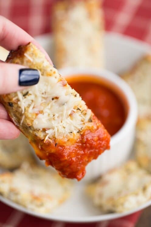 Cheesy Cauliflower Breadsticks dipped in marinara sauce