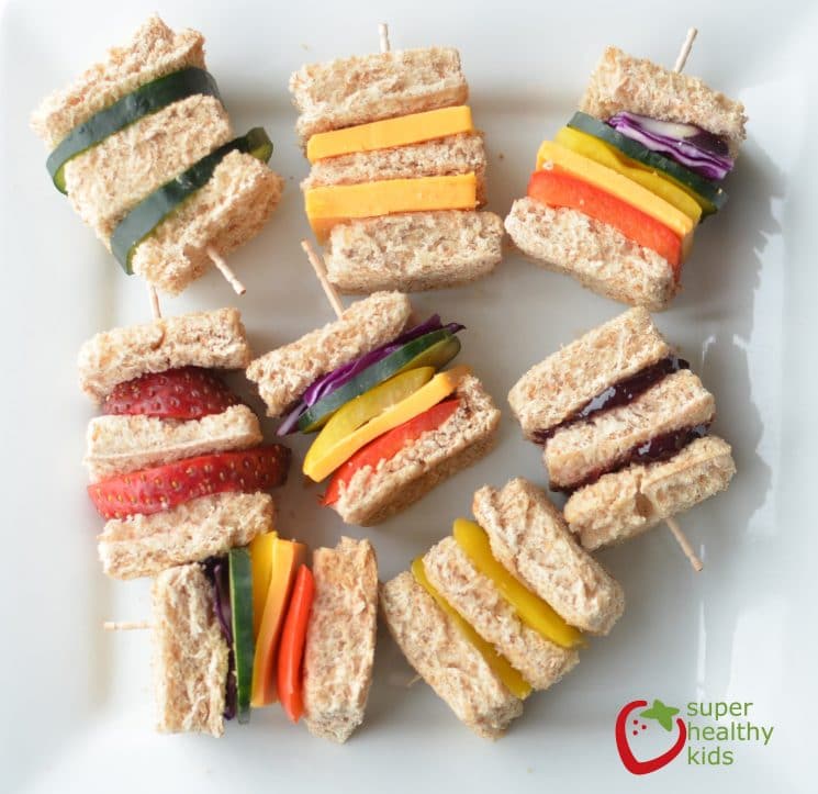 Lunch Box Idea: Mini Rainbow Sandwiches. Lunch box idea using a variety of fruits and veggies for mini sandwiches.