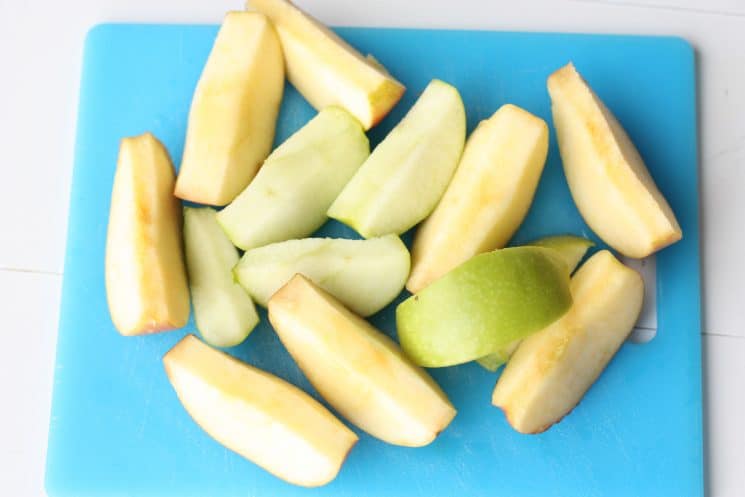 cut apples on a cutting board