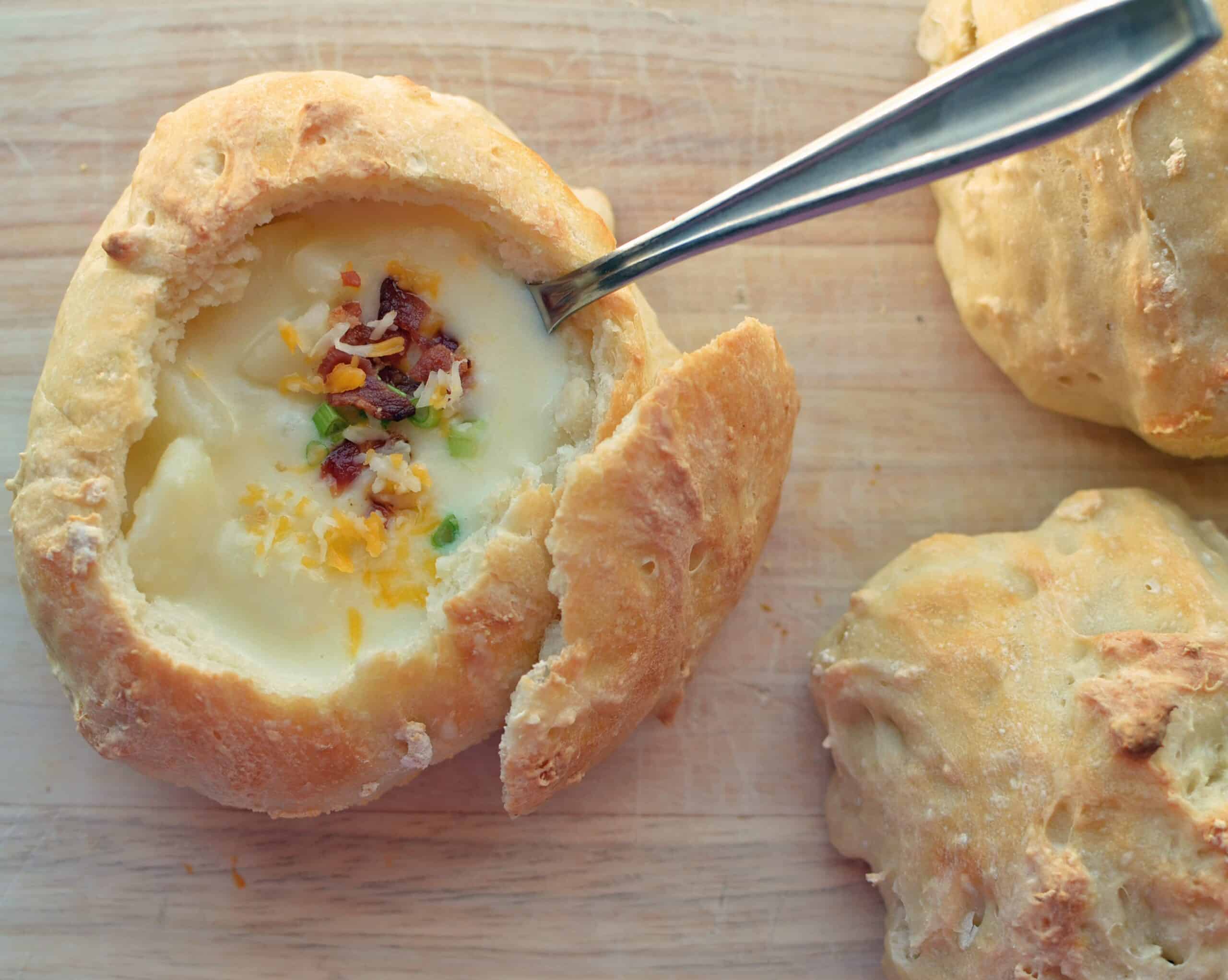 loaded baked potato soup in homemade bread bowls