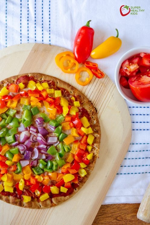 Rainbow Pepper Pizza. A great way to add nutrients to pizza...pile it with veggies! with bell peppers and red onions