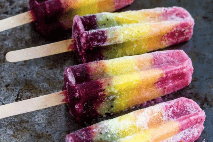 rainbow colored popsicles with wooden popsicle sticks