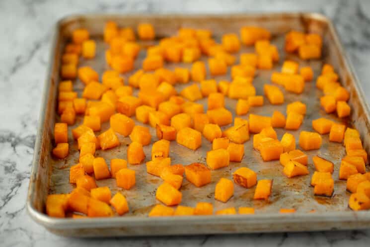 baking sheet full of roasted butternut squash cubes