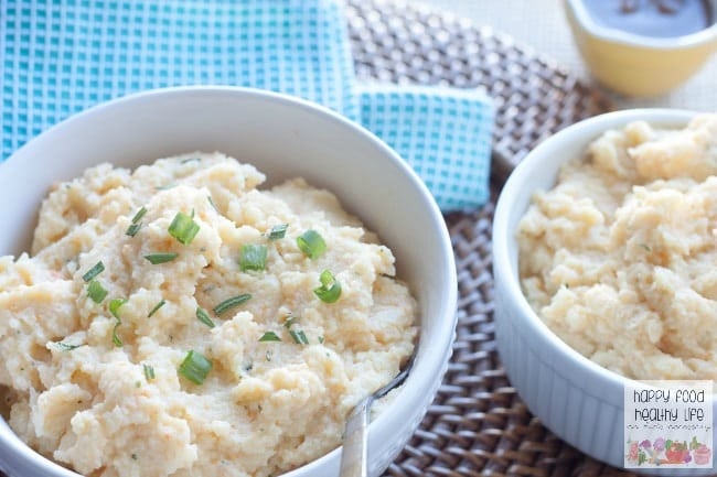 Garlic & Herb Mashed Cauliflower. A health-conscious side dish that is so delicious you won't even be missing the potatoes! In fact, you may not even realize they aren't potatoes!