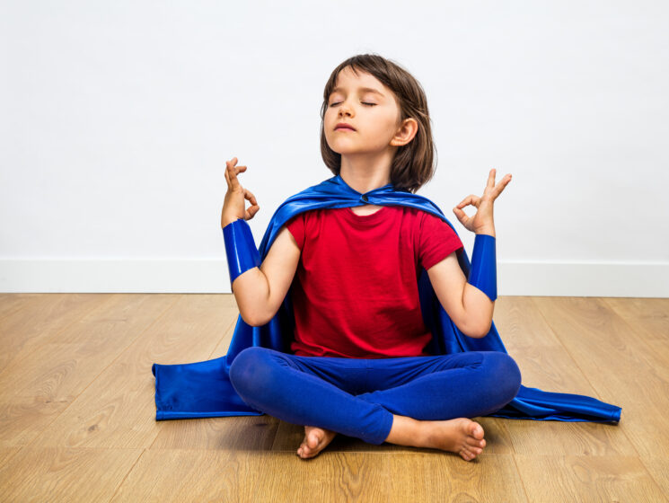 child in a yoga pose