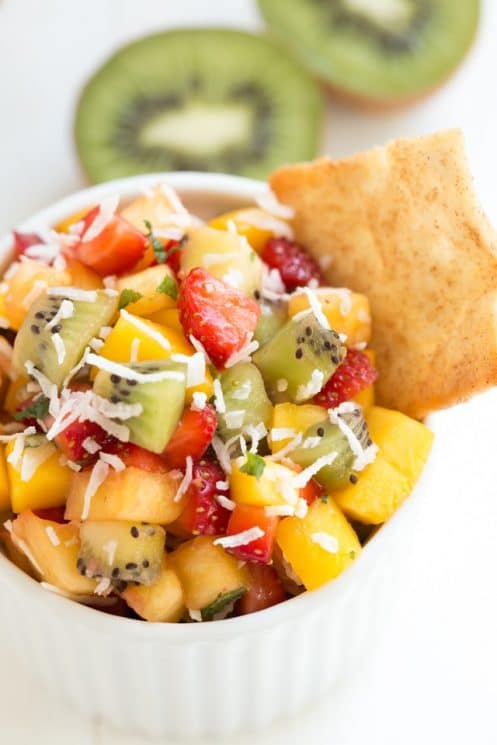 Easy Tropical Fruit Salsa made with fresh mango, pineapple, kiwi, strawberries and unsweetened coconut! www.superhealthykids.com 