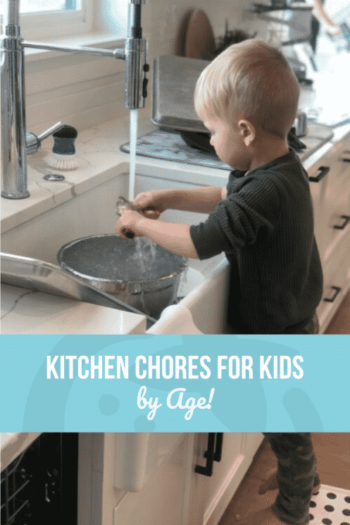 small boy at the sink washing dishes