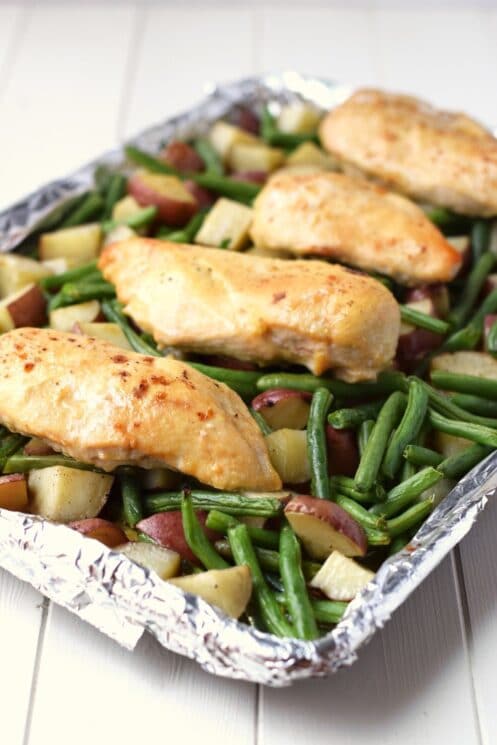 One Pan Honey Garlic Chicken and Vegetables - Chicken breasts, potatoes and green beans all cook together in under 30 minutes and in one pan. As simple and easy as a healthy dinner recipe gets! www.superhealthykids.com