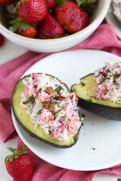 Strawberry Pecan Chicken Salad is made with fresh strawberries, pecans, and Greek yogurt! Serve the salad is fresh avocado bowls.