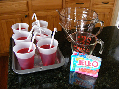 cups of jello with a straw to resemble a cup of juice