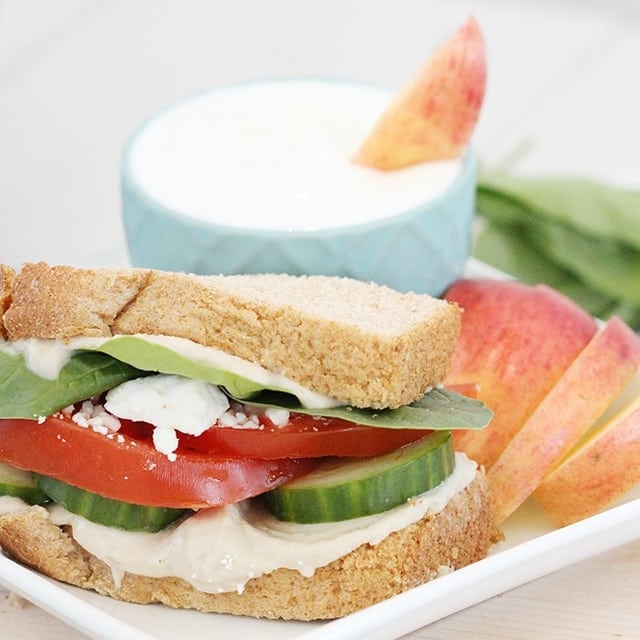 veggie sandwich served with apple slices