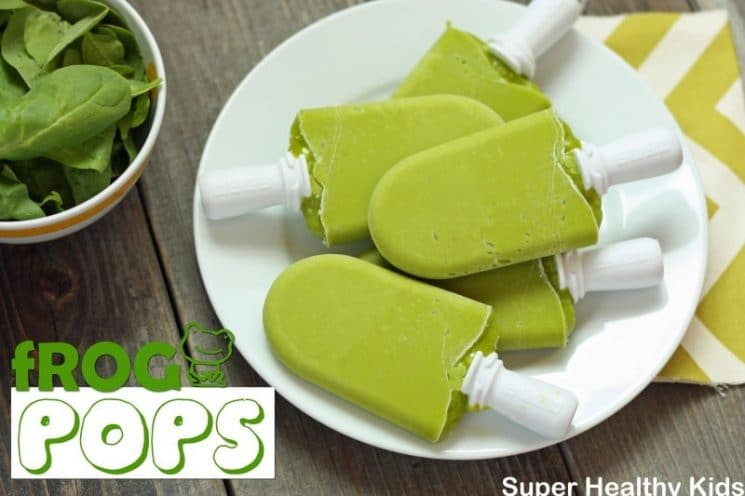 green homemade popsicles on a white plate