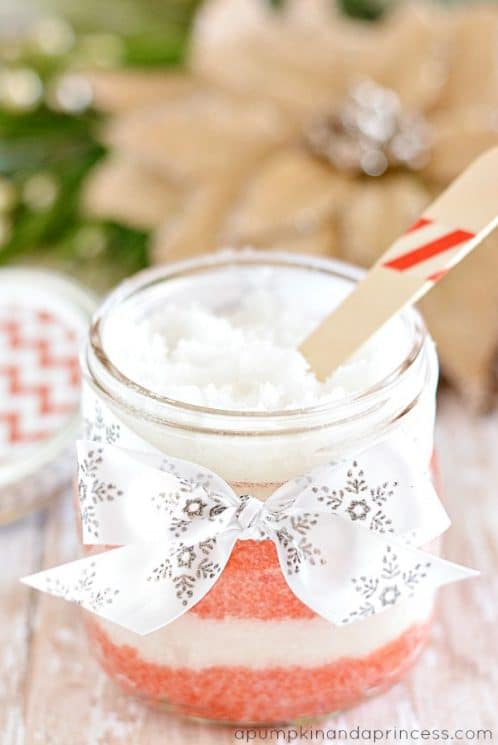 Peppermint sugar scrub in a jar with a wooden spoon 