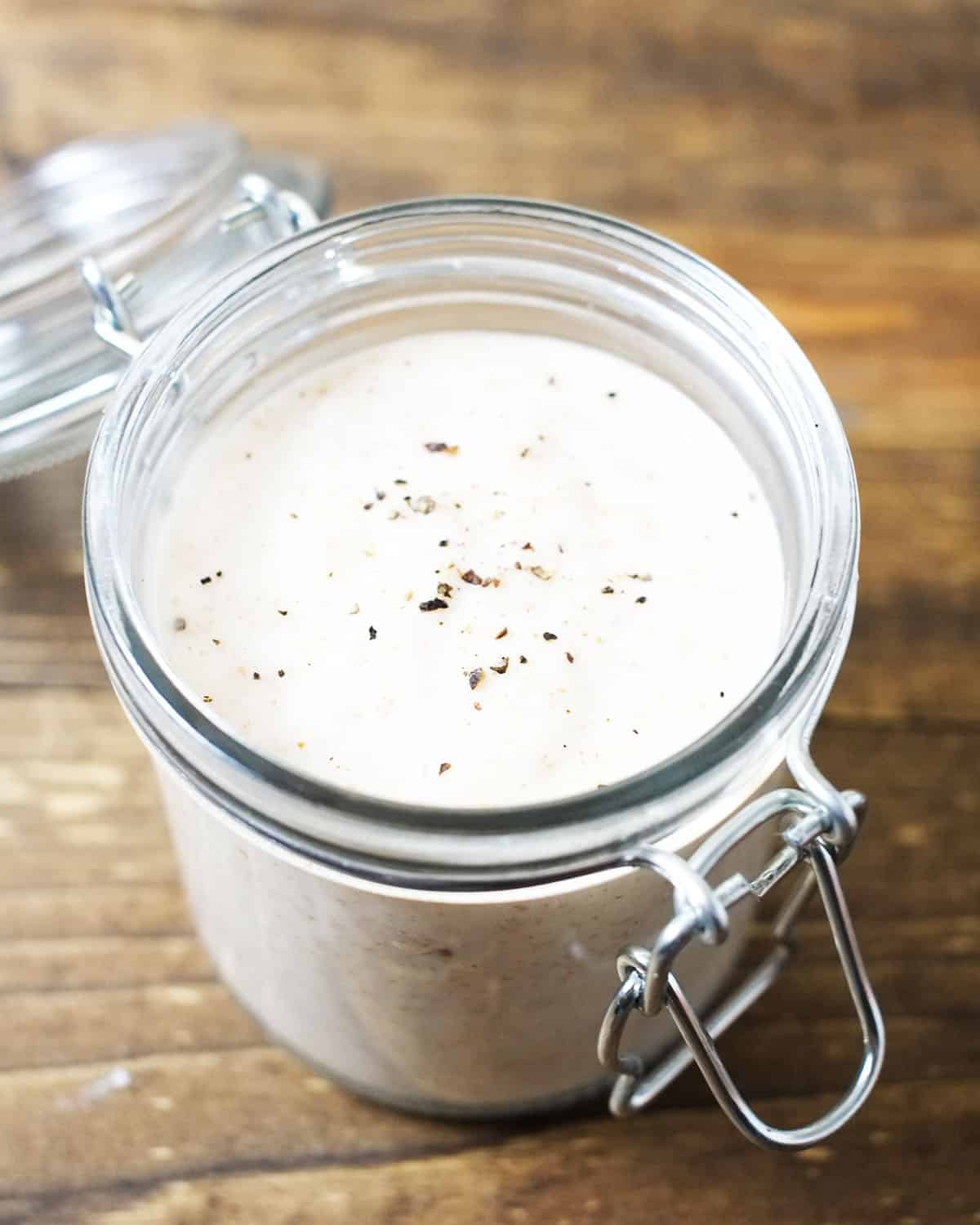 cream of chicken soup in a mason jar with a lid on a wood background