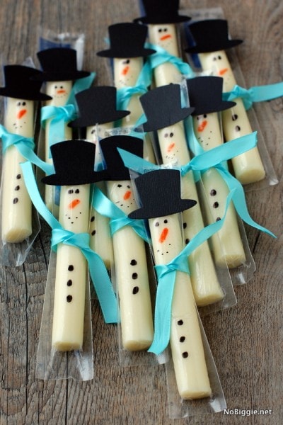 String cheese with snowman decorations made of paper