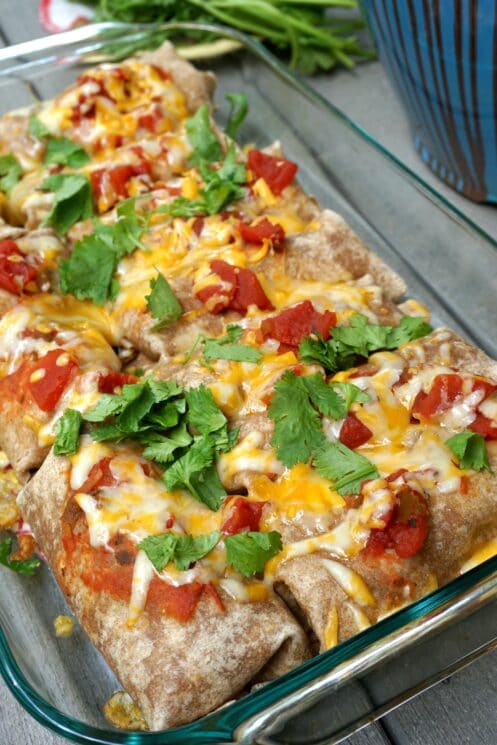 Closer look of baked pan of beef and bean burritos.