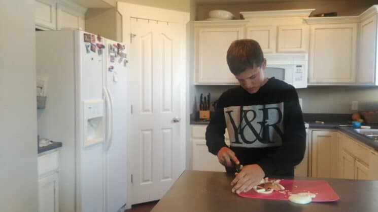 teenager making dinner