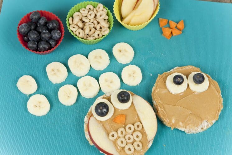 fun food for kids idea- owl rice cakes, preparation, bananas and blueberries and fruit