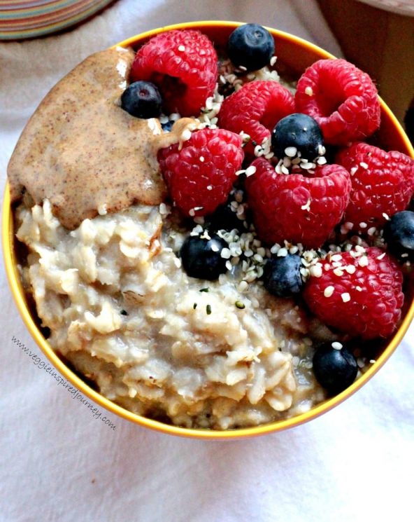 Creamy Healthy Oatmeal with Berries, Almond Butter and Hemp Seeds