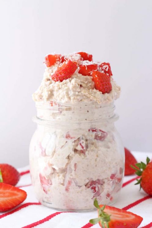 Strawberry Shortcake Overnight Oats in a Mason Jar with fresh strawberries