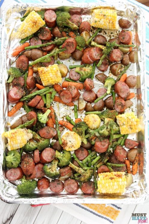 Healthy Easy Sausage and Veggie Sheet Pan Dinner with corn and broccoli and sausage and carrots