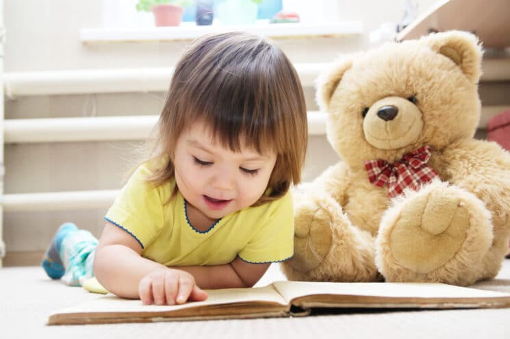 Girl reading a story that teaches nutrition