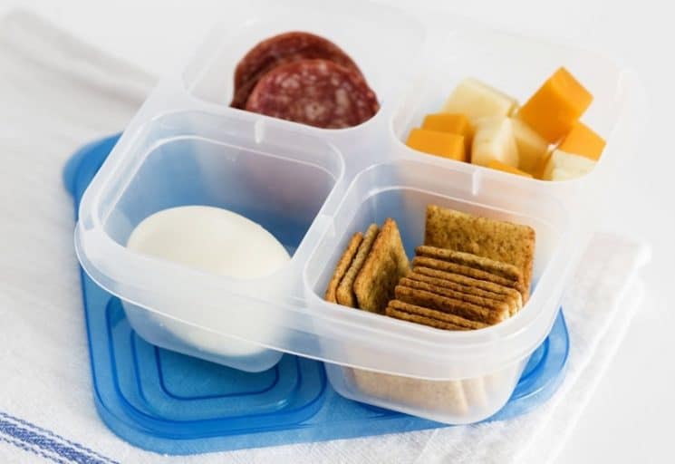 boiled egg, crackers, cheese cubes pepperoni in a snack box to take to a theme park