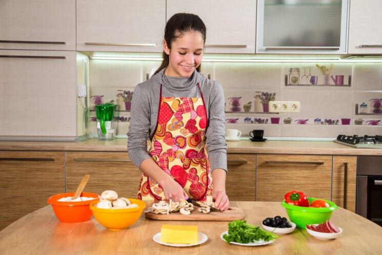 teenager making dinner