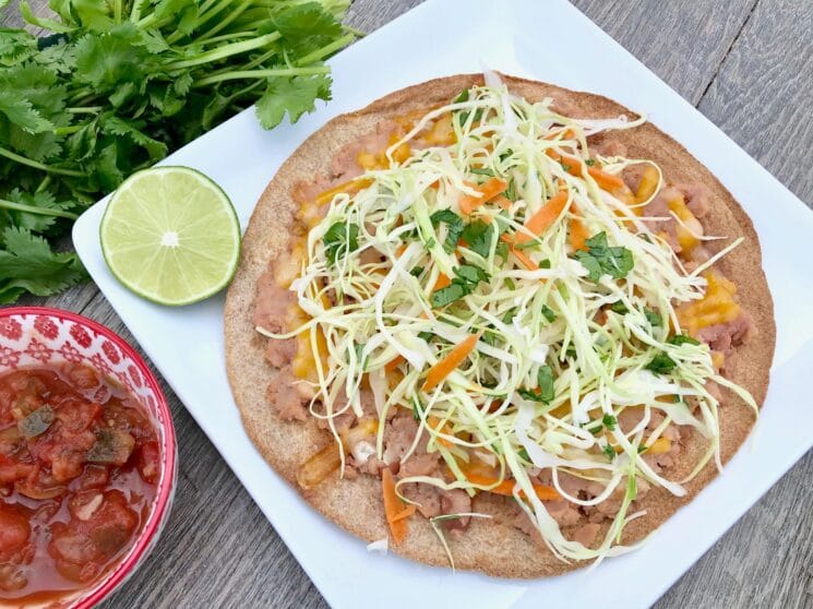 tostada with shredded veggies and herbs