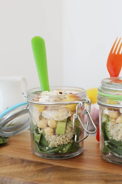 Sweet and Savory Peach Quinoa Salad in jars with forks