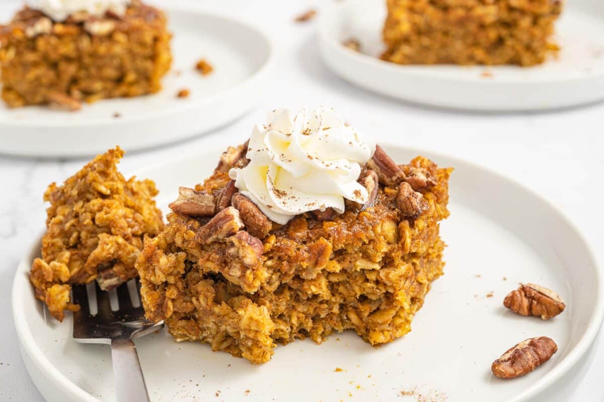 baked pumpkin oatmeal topped with whipped cream