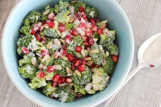 holiday broccoli salad with sunflower seeds, pomegranate, and creamy dressing