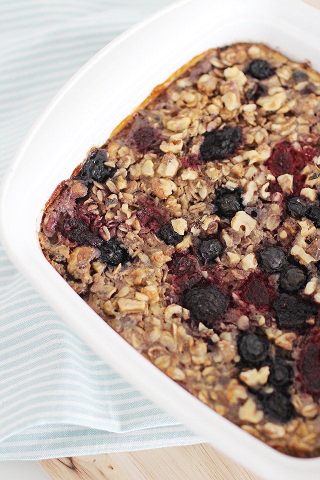 No more boring stove-top oats! Warm, chewy, sweet baked oatmeal is bursting with berries, bananas, and walnuts. Slide this simple concoction into the oven and earn some hands-off time before breakfast. baking dish of baked berry oatmeal