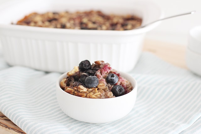 No more boring stove-top oats! Warm, chewy, sweet baked oatmeal is bursting with berries, bananas, and walnuts. Slide this simple concoction into the oven and earn some hands-off time before breakfast. berry baked oatmeal