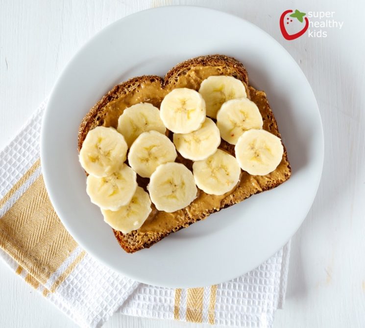 peanut butter toast with bananas on a plate